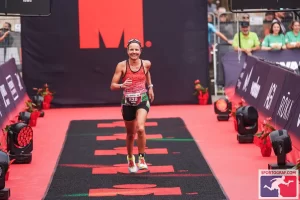 IRONMAN athlete running in hot conditions — heat management strategy for triathlon